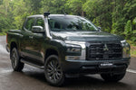 Dark green Mitsubishi Triton MV front three-quarter with stainless Roar 4x4 snorkel fitted