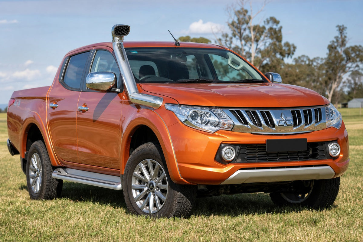 Orange Mitsubishi Triton MQ with stainless Roar 4x4 snorkel fitted